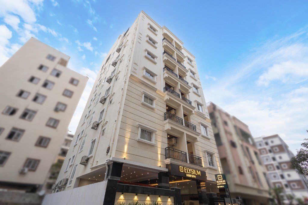 Elysium Premier Suites, Hitec City — Building facade, blue hour