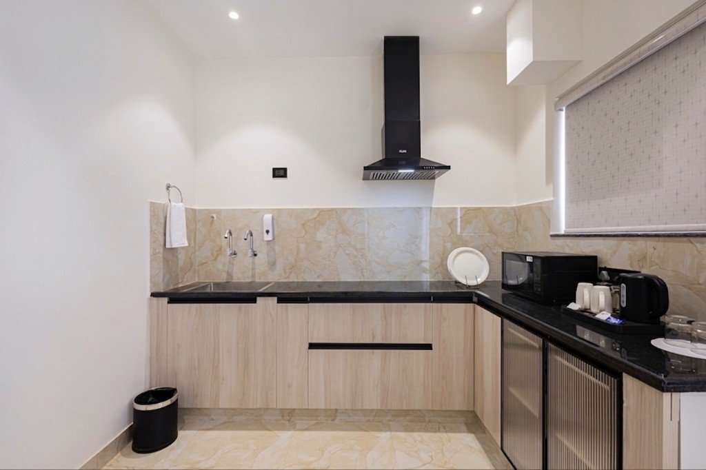 Elysium Premier Suites, Hitec City — Living area and bedroom