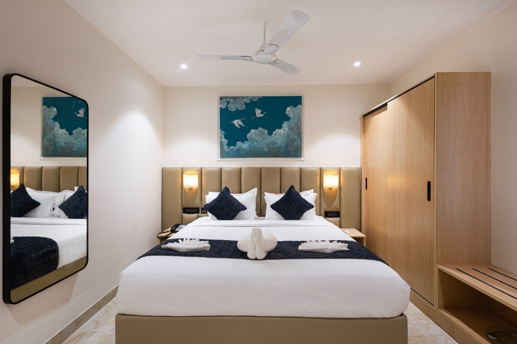 Elysium Premier Suites, Hitec City — Bedroom opening to living area