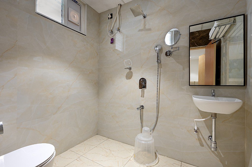 Elysium Premier Suites, Hitec City — Shower and vanity area